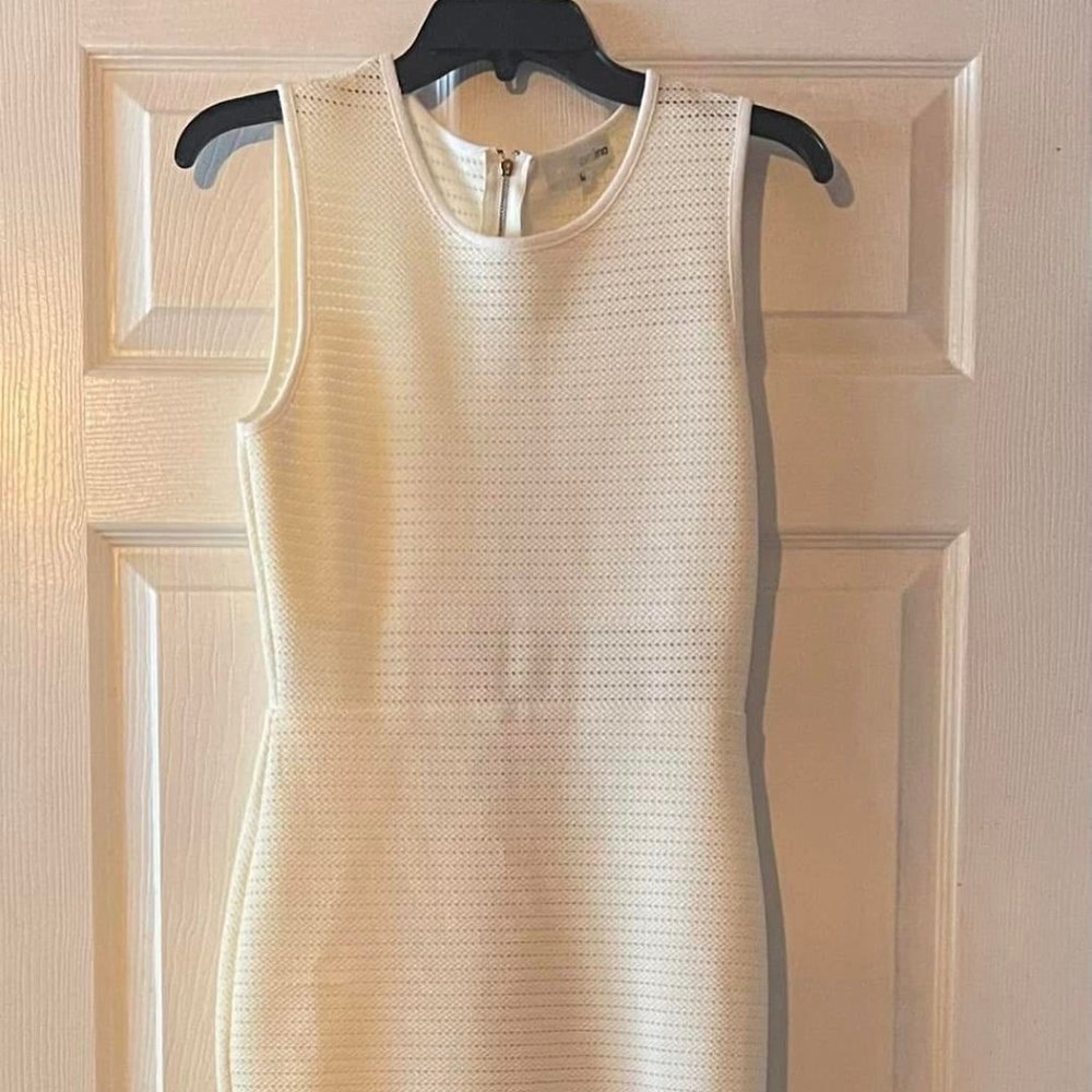 Women's Size M.. Classic  Creamy White..  Knee length..   No stains, or tears